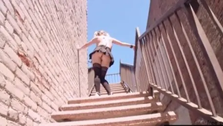 Blonde haired Aiden Starr stroking on the street