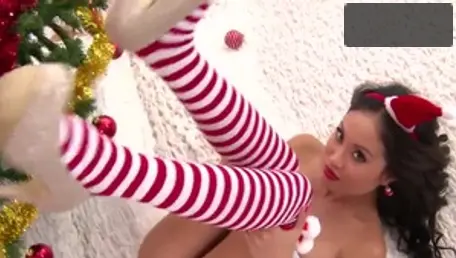 Sexy girl asian teasing on the Christmas solo